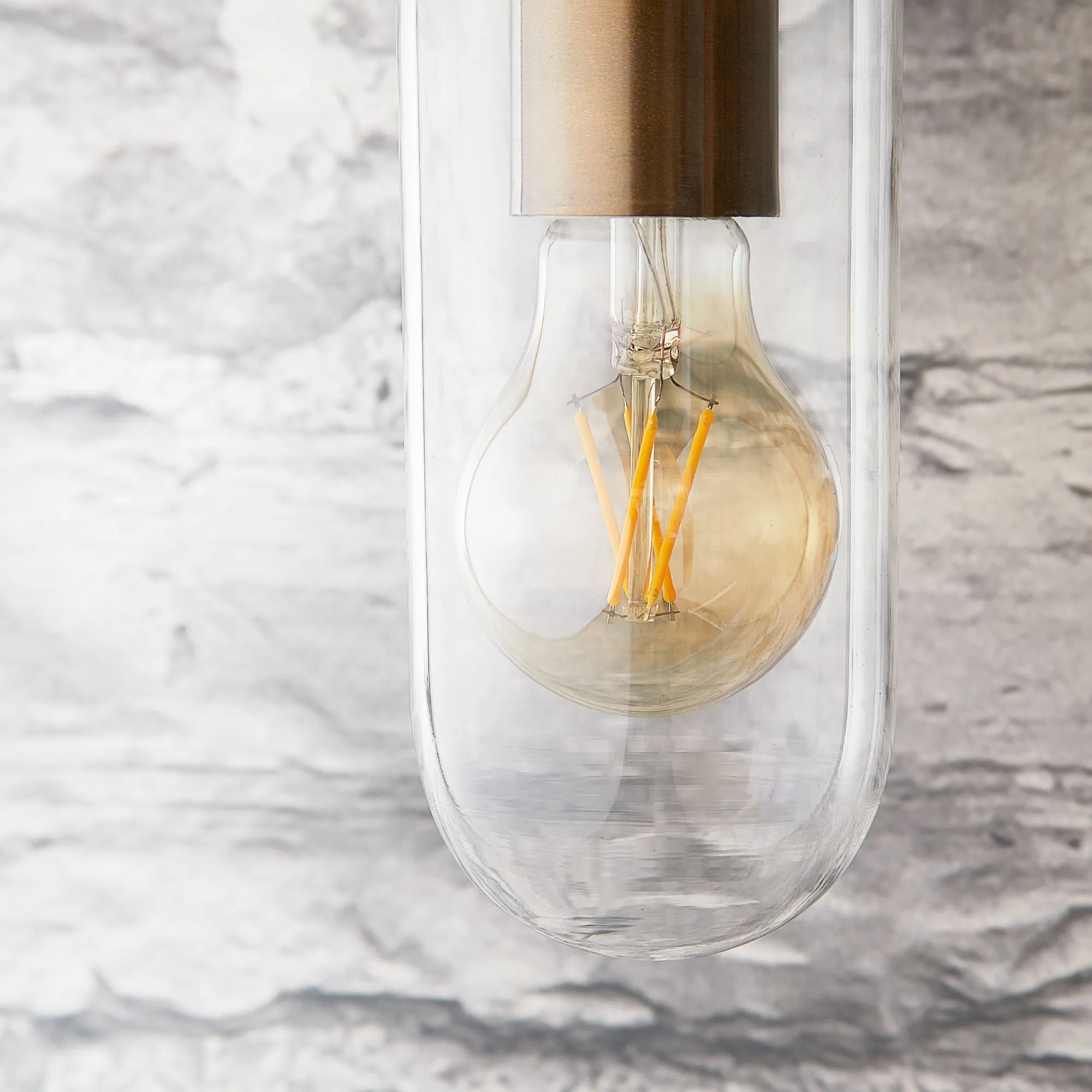 Curlew IP44 wall light in antique brass