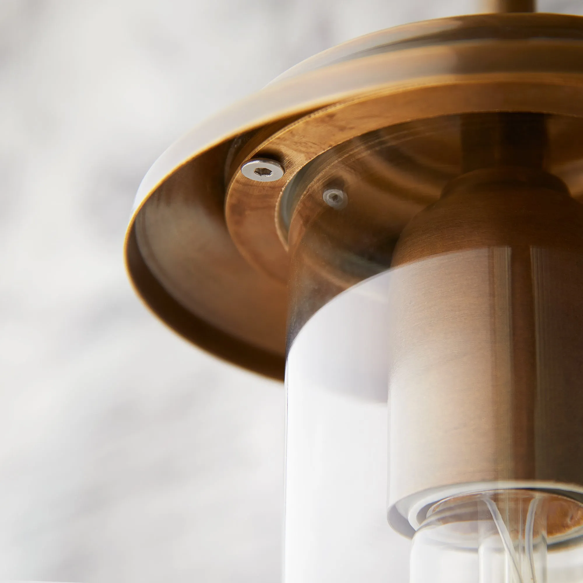 Curlew IP44 wall light in antique brass